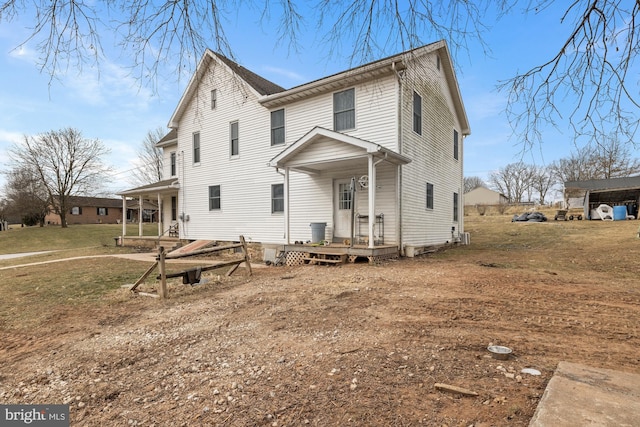 view of front of home with a porch and a front yard