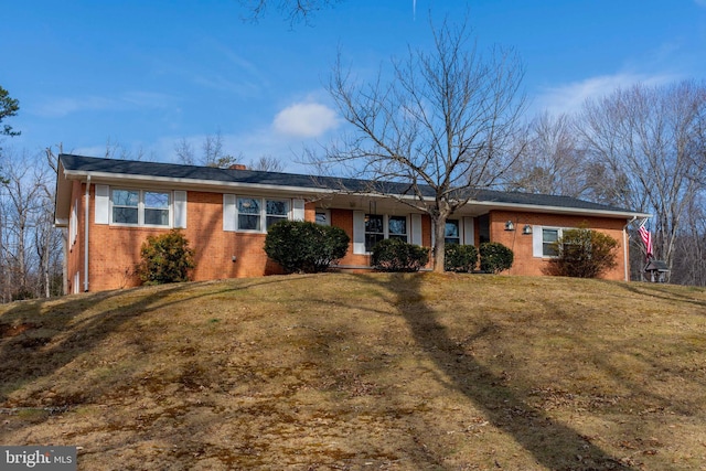 ranch-style house with a front yard