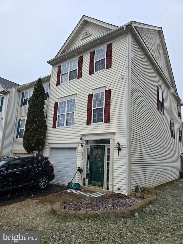 view of front of property with a garage