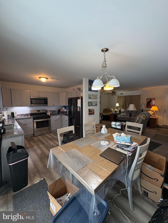 dining space with dark wood-type flooring