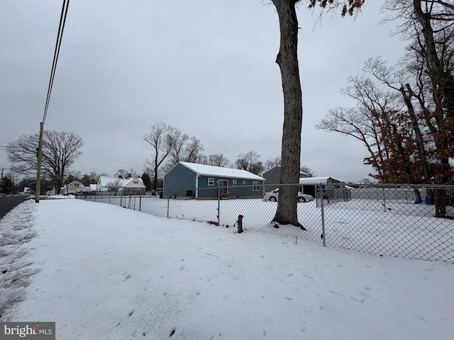 view of yard layered in snow