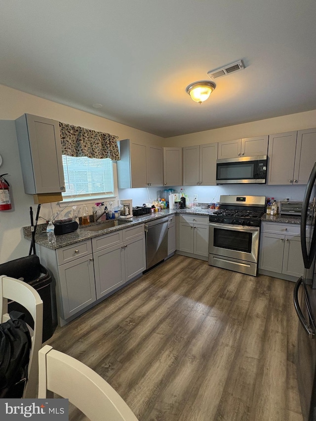 kitchen featuring gray cabinets and stainless steel appliances