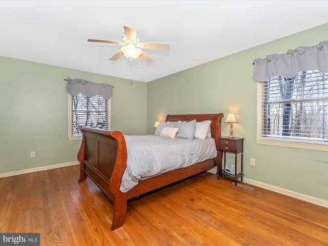 bedroom featuring hardwood / wood-style flooring and ceiling fan