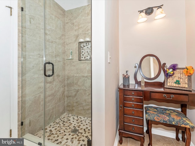 bathroom with tile patterned flooring and a shower with door