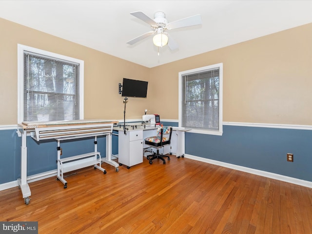 office space with ceiling fan and wood-type flooring