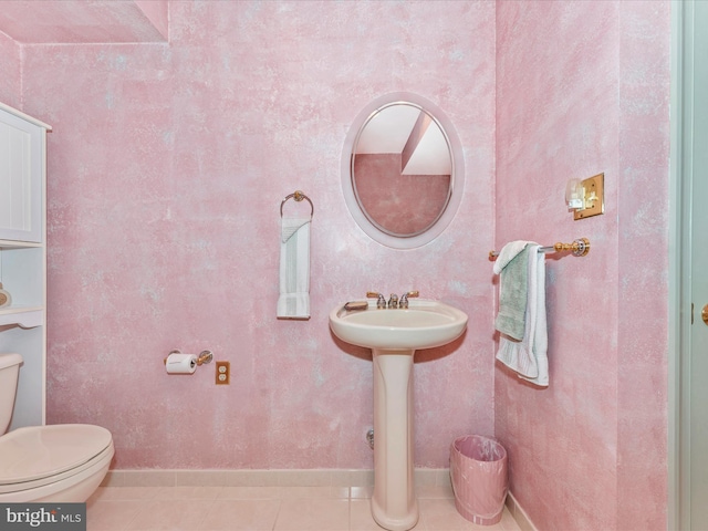 bathroom featuring tile patterned flooring and toilet