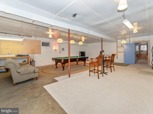 game room with pool table and concrete floors