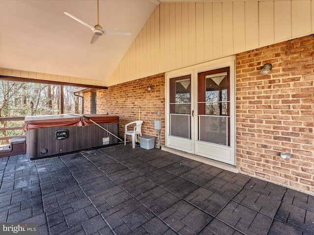 view of patio featuring ceiling fan and a hot tub