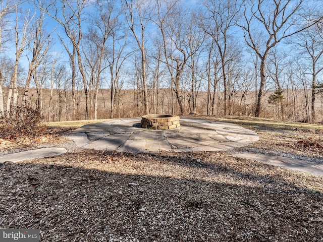 exterior space featuring an outdoor fire pit