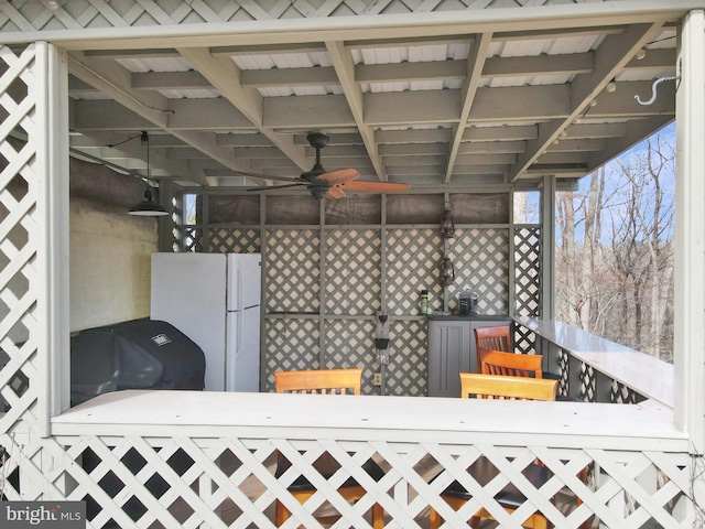 view of patio featuring ceiling fan