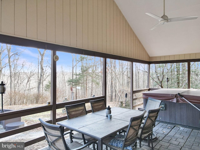 sunroom with lofted ceiling and ceiling fan