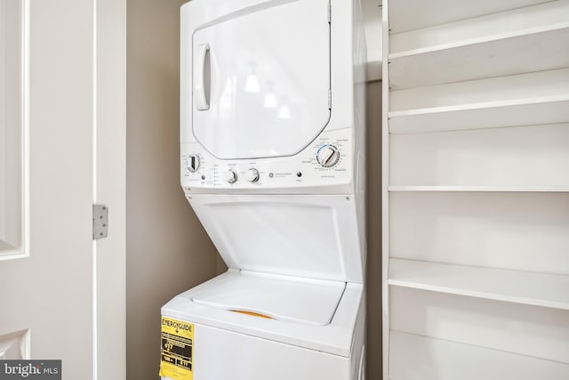 laundry room featuring stacked washer and clothes dryer