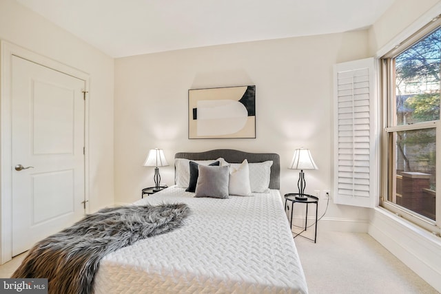 bedroom with light carpet