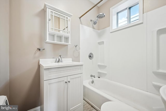 bathroom with shower / bathing tub combination and vanity