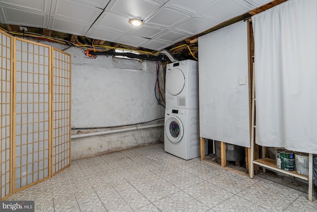 laundry area featuring stacked washer / dryer