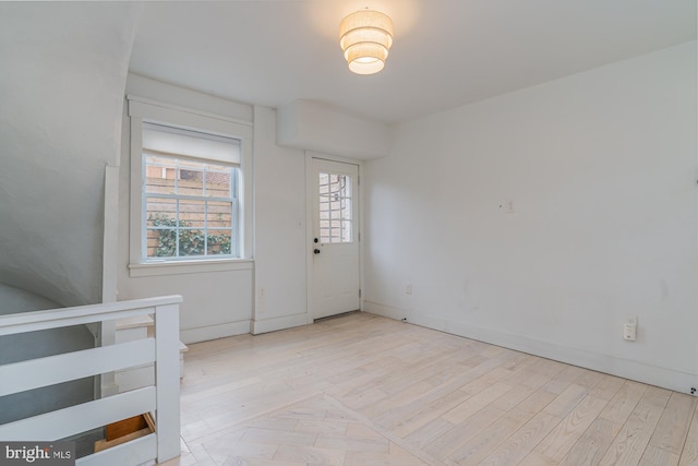 foyer entrance with light hardwood / wood-style floors