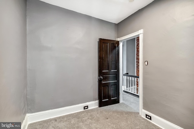 spare room with light colored carpet