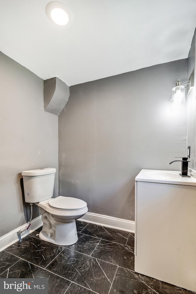 bathroom featuring sink and toilet