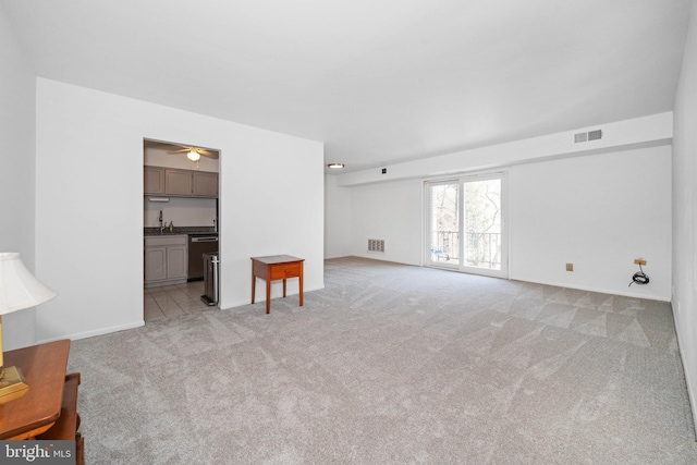 living room featuring light carpet