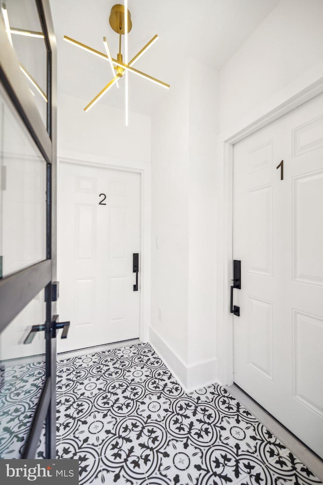 entrance foyer featuring a notable chandelier