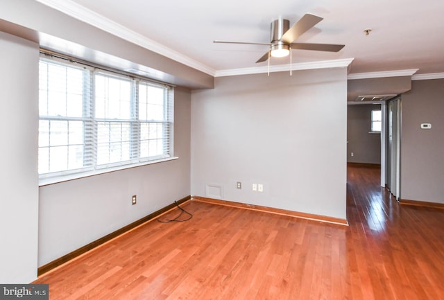 unfurnished room with hardwood / wood-style floors, ornamental molding, and ceiling fan