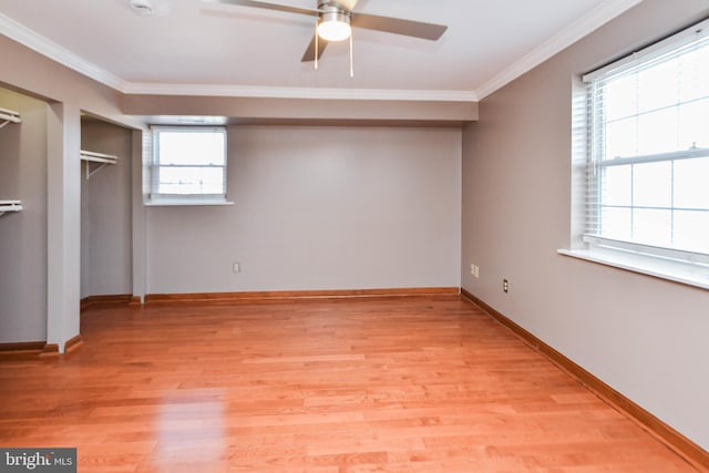 unfurnished bedroom with crown molding, ceiling fan, and light wood-type flooring