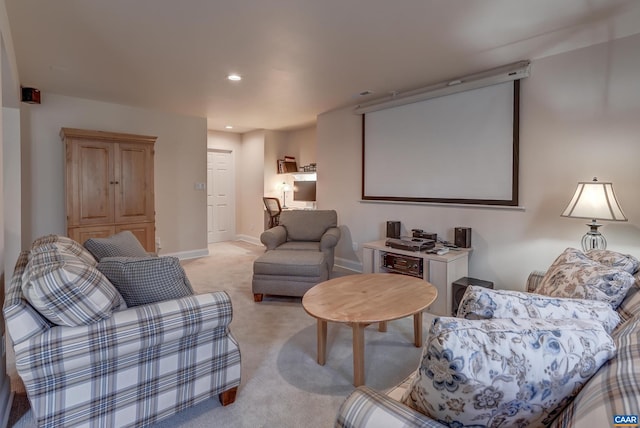 cinema room featuring light colored carpet