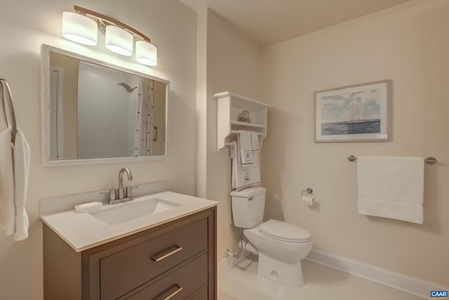 bathroom with vanity, a shower, tile patterned floors, and toilet