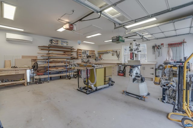 garage with a garage door opener, a wall unit AC, and a workshop area