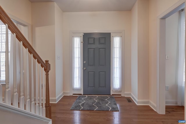 foyer featuring dark hardwood / wood-style floors