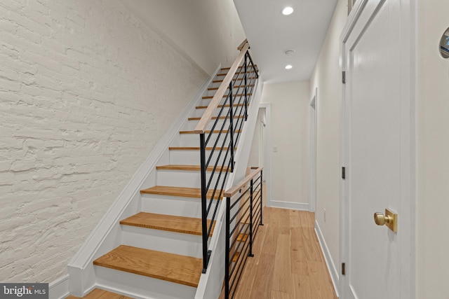 stairway featuring hardwood / wood-style floors