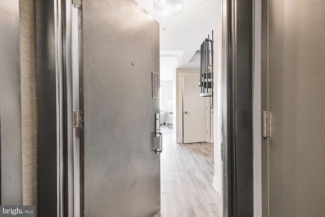 corridor featuring light wood-style flooring