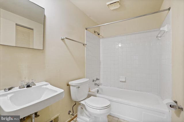 full bath with tile patterned floors, toilet, bathing tub / shower combination, and a sink