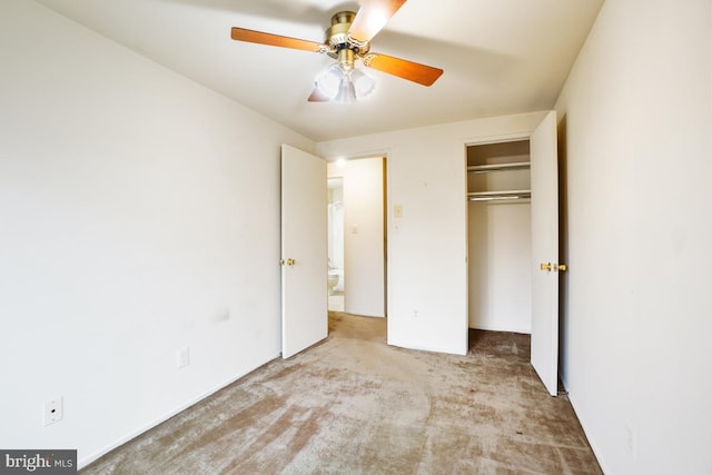 unfurnished bedroom featuring a closet, a ceiling fan, and carpet flooring