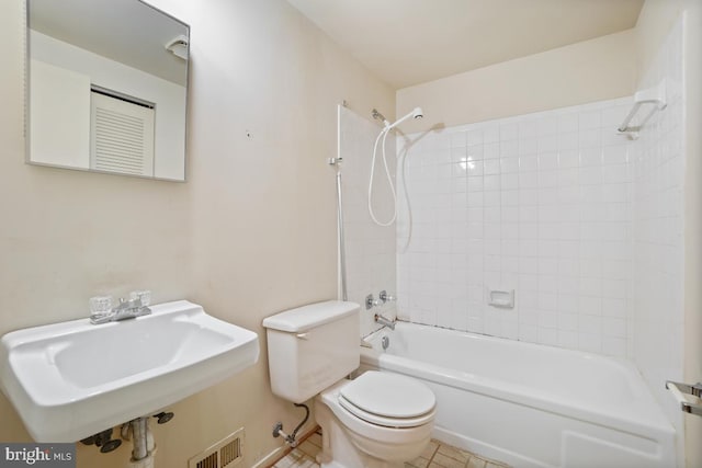 bathroom featuring visible vents, toilet, bathing tub / shower combination, and a sink