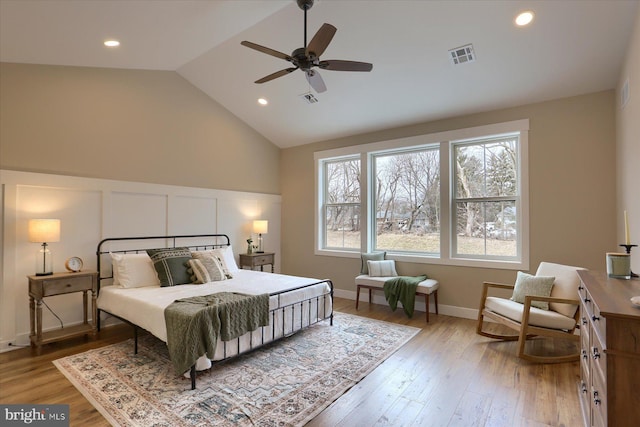 bedroom with vaulted ceiling, wood-type flooring, and ceiling fan