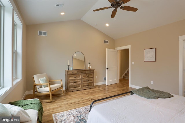 bedroom featuring ceiling fan, high vaulted ceiling, and light hardwood / wood-style flooring