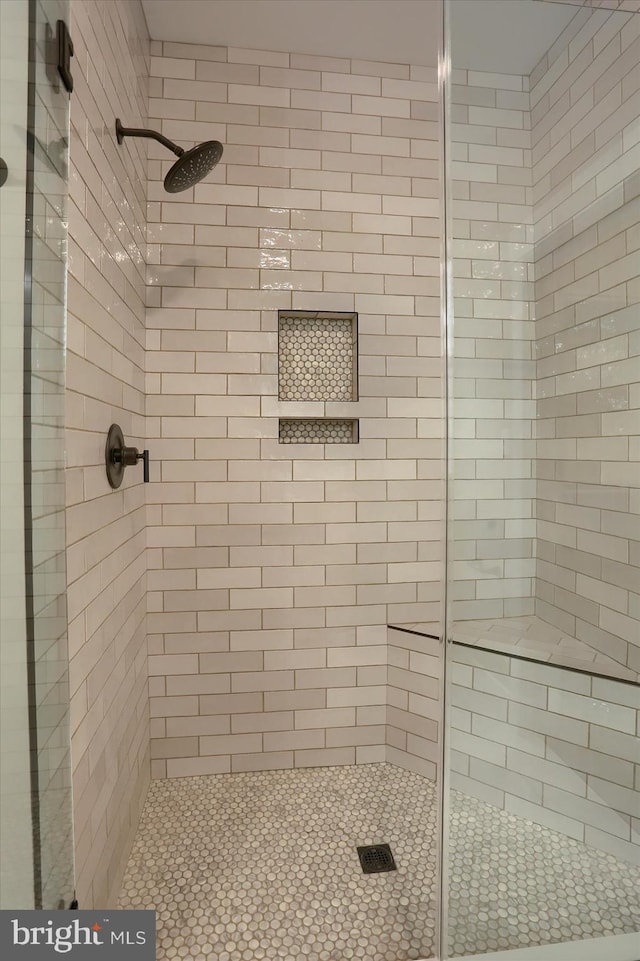 bathroom featuring an enclosed shower