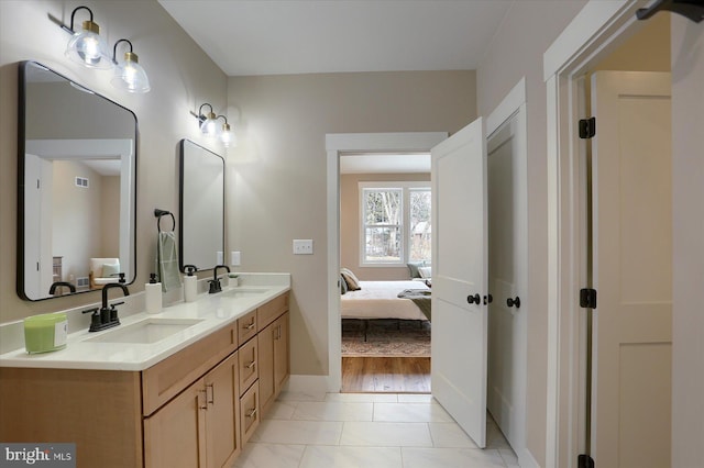 bathroom featuring vanity and tile patterned flooring