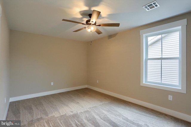 unfurnished room featuring light carpet and ceiling fan