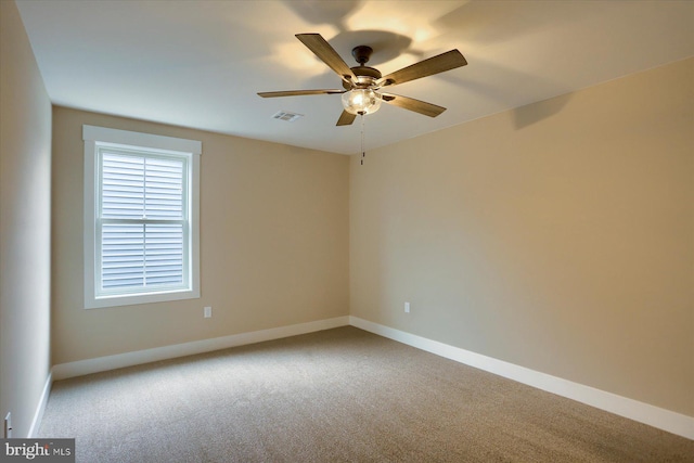 empty room with light carpet and ceiling fan