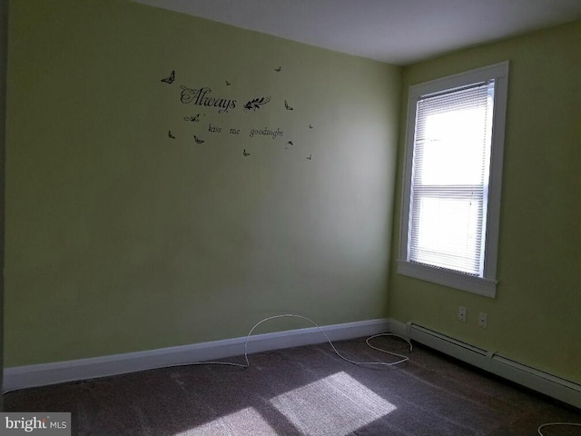 unfurnished room featuring a baseboard radiator and carpet