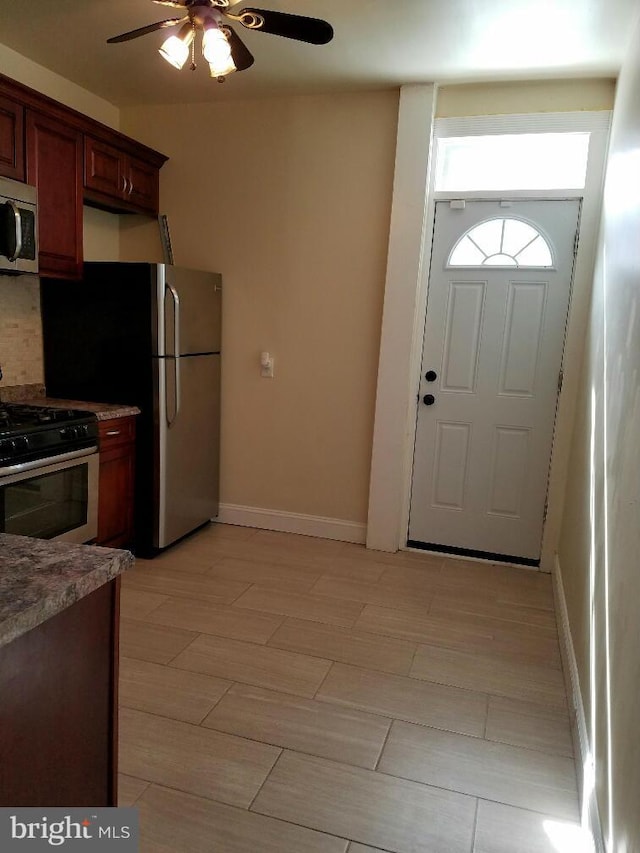 kitchen featuring ceiling fan and appliances with stainless steel finishes