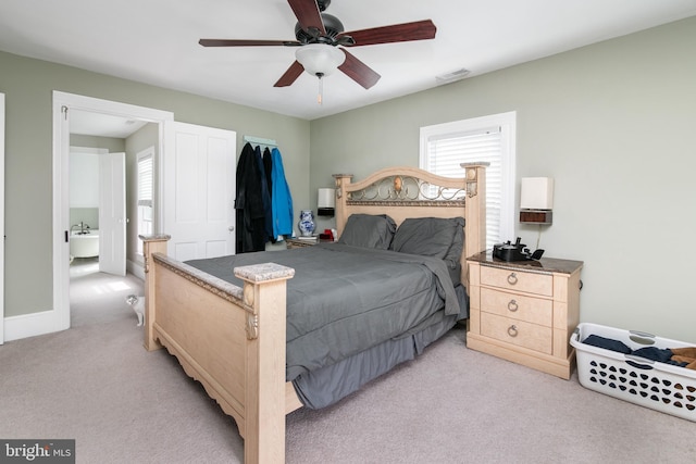 carpeted bedroom with ceiling fan