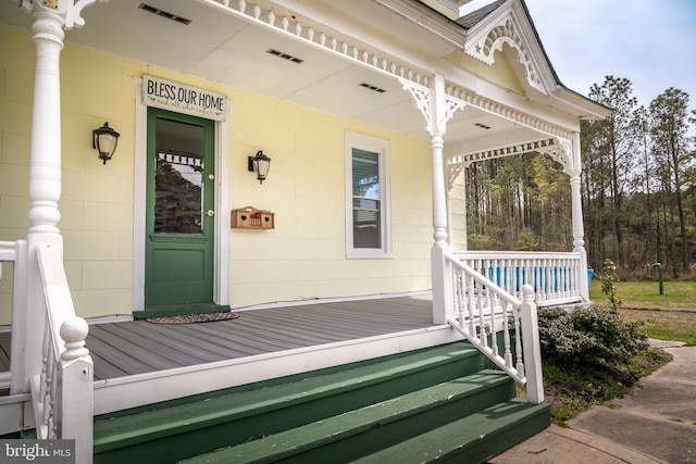 doorway to property with a porch