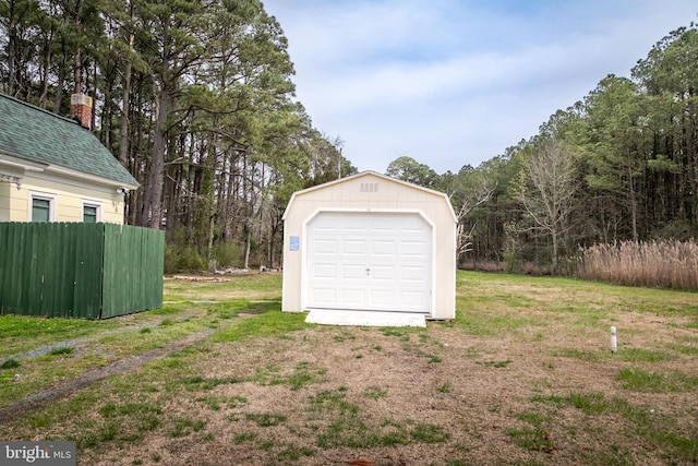 garage featuring a lawn