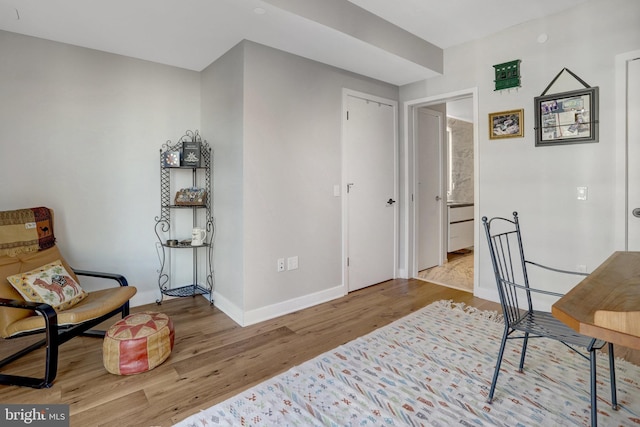 office featuring light wood-style floors and baseboards