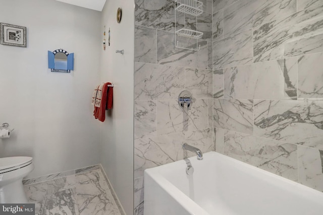 bathroom featuring shower / washtub combination, marble finish floor, toilet, and baseboards