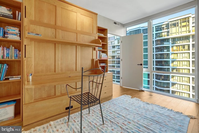 interior space with light wood-style floors and visible vents