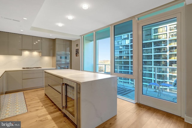 kitchen featuring modern cabinets, light countertops, and gray cabinetry